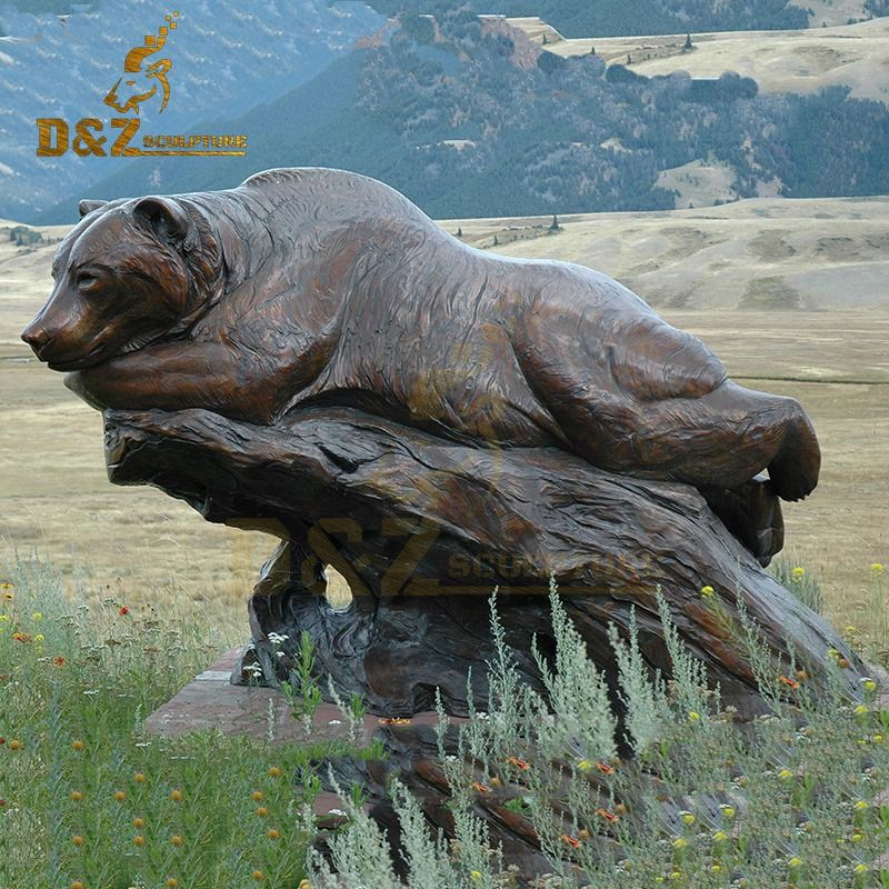 New design metal casting bear sculpture lying on the rock for sale